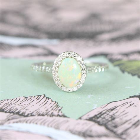 However, a good engagement ring never goes out of style. Opal and Diamond halo engagement ring in 14 carat white ...