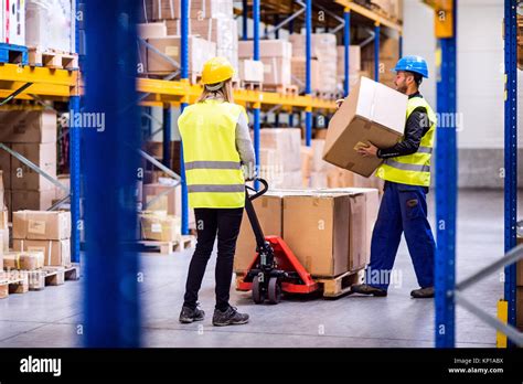 Young Workers In A Warehouse Stock Photo Alamy