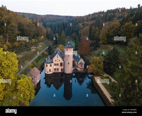 Aerial Of Schloss Mespelbrunn Castle With Reflection In Moat