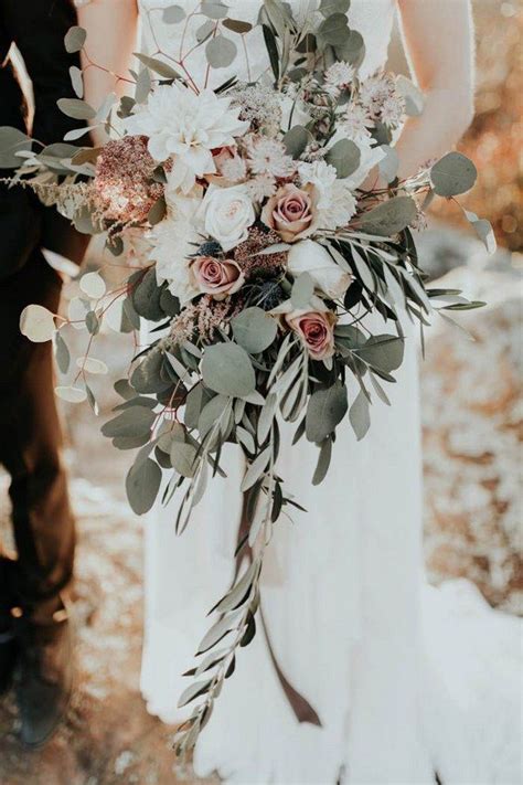 It was done here with amaranthus in the centerpieces, but you could also use table linens, colorful taper candles , glassware, or yellow flowers, such as mums and dahlias. Blush, ivory, and sage green cascading bridal bouquet ...