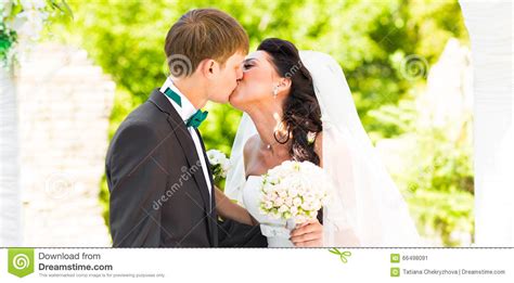 Couple Getting Married At An Outdoor Wedding Ceremony Stock Image