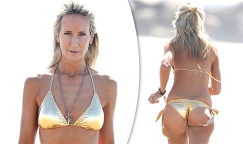 lady victoria hervey exposes her pert posterior in bond girl bikini celebrity news showbiz