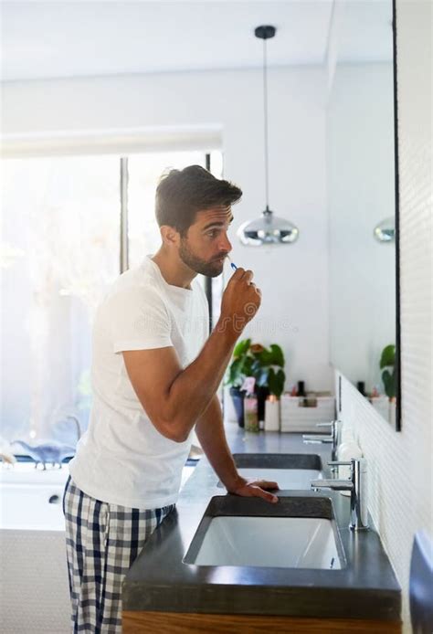 Clean The Entire Mouth Correctly To Avoid The Dentist A Handsome Man Brushing His Teeth In The
