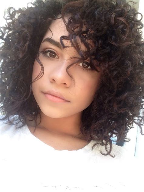 The entire hair is layered for movement and volume. Natural 3b/3c curly hair by Serena.Nicol