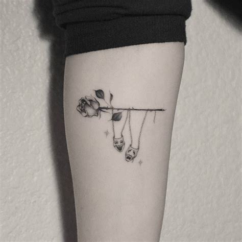 Sailors selected the rose tattoo for an honorary intent, as its willowy build becoming linked to femininity, to symbolize, their mother, their wife, or their girlfriend. Single needle drama masks hanging from a rose tattoo on ...