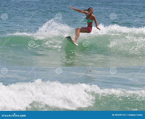 Surfer Girl Carving A Wave In The Outer Banks Of Nc Stock Photo Image