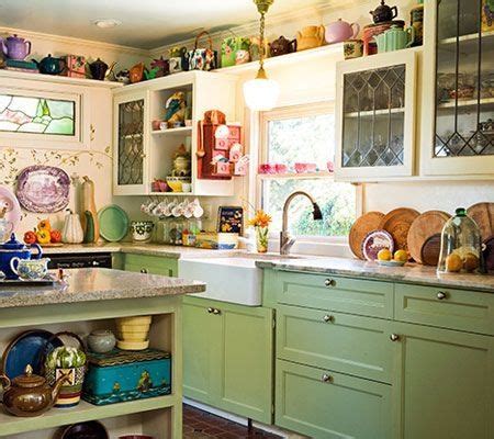 Brighten up a saturated shade by incorporating reflective white surfaces, like tile and stone, as well as metallic gold accessories, such as cabinet hardware, faucets, and light fixtures. Vintage Cottage Kitchen--love the green cabinets below ...