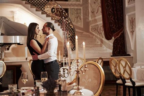 guy going to kiss his woman beautiful couple have romantic dinner in luxury restaurant at