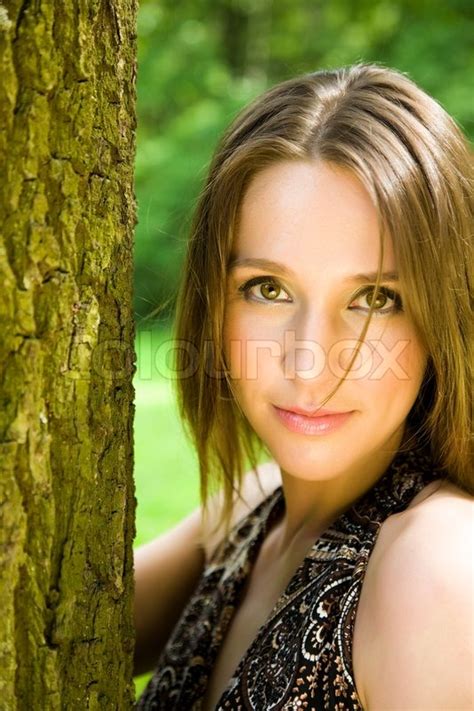 Portrait Of A Beautiful Women On Natural Background