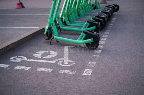 Dedicated Electric Scooter Parking Spot On City Sidewalk Stock Photo