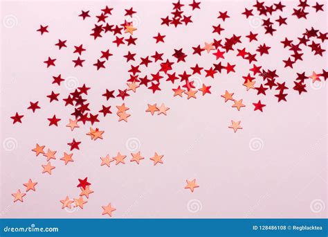 Festive Pastel Pink Background With Metallic Confetti Stock Photo