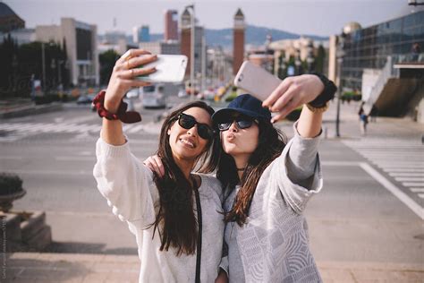 Happy Women Taking Double Selfie Del Colaborador De Stocksy Guille