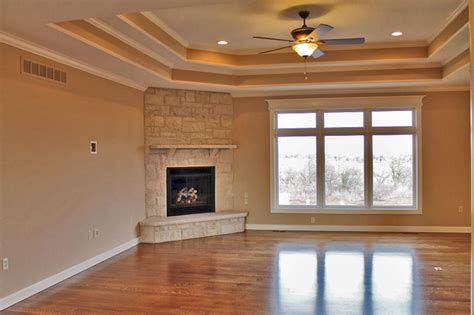 These types of ceiling finishes at a minimum conceal its height. living room fireplace tiered cove ceiling | Mark Boling ...