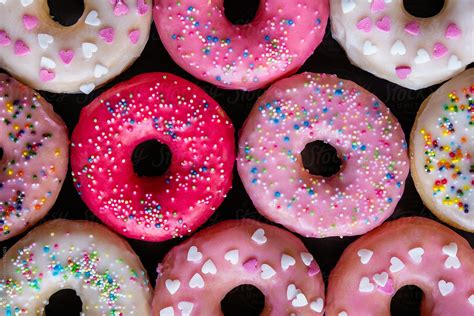 Pastel Color Donuts On Dark Background By Stocksy Contributor Pixel