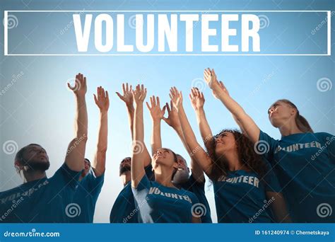 Group Of Volunteers Raising Hands Outdoors Stock Photo Image Of Care