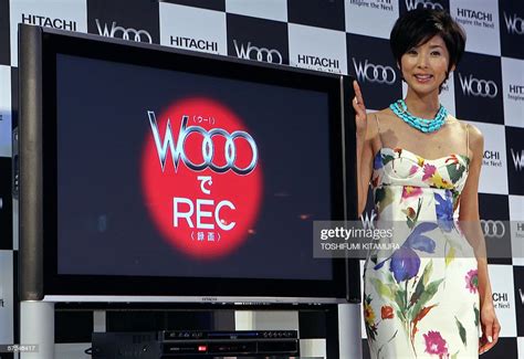 Japanese Actress Hitomi Kuroki Stands Beside Hitachis Latest 42 Inch