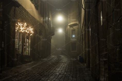 Old Narrow Street Of Medieval Town Containing Dark Alleyway And Alley