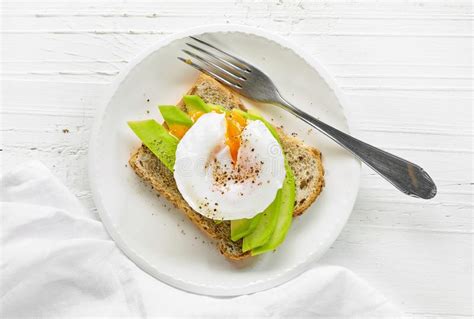 Sandwich With Avocado And Poached Egg Stock Image Image Of Eating