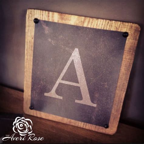 A Wooden Sign With The Letter A On It