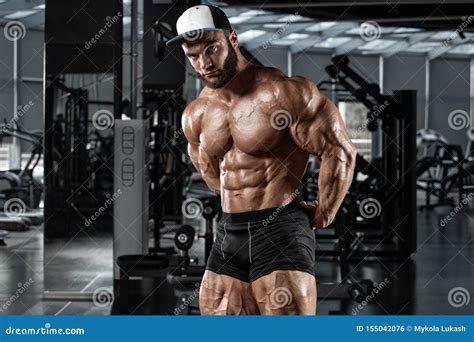 Muscular Man Showing Muscles In Gym Workout Strong Bodybuilding Male