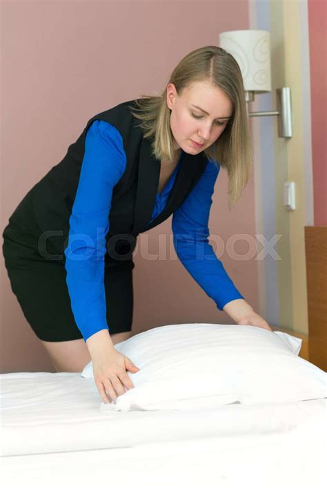 Room Service Woman Making Bed In Hotel Room Stock Image Colourbox