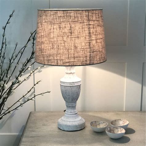 White bedroom lamps are easy to find, but if you're going for a modern minimalist interior it's important to find something with a contemporary form that playful yellow table lamp: Antique White Distressed Table Lamp Linen Shade By Cowshed Interiors | notonthehighstreet.com