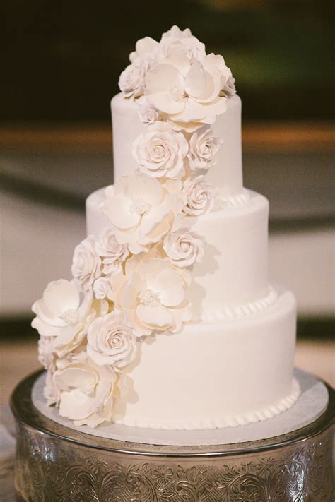 White On White Wedding Cake With Cascading Flowers Wedding Cake Roses