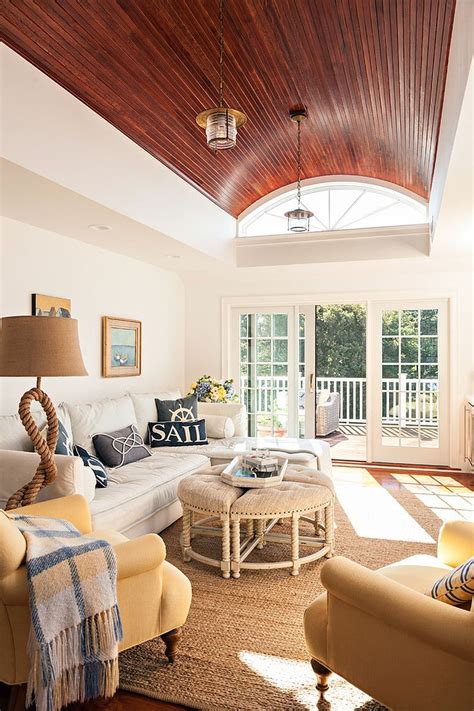 Rope Lamp And Throw Pillows Bring The Coastal Charm To This Sunroom