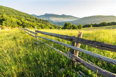 Fence On Hillside Meadow In Mountain Stock Image Colourbox