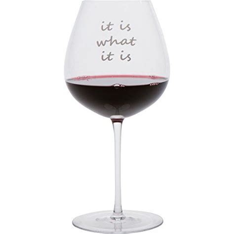 A Wine Glass Filled With Red Wine That Says It Is What It Is