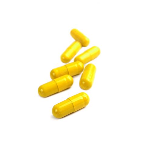 Premium Photo Yellow Pill Capsules Isolated On White Background