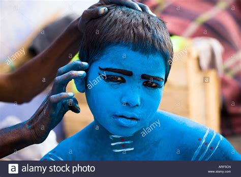 A Young Indian Boy Painted With Blue Powder Pigments To Celebrate The