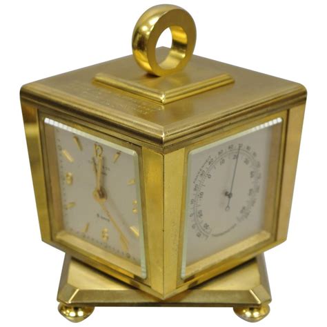 Tiffany And Co Eight Day Brass Four Caster Revolving Small Desk Clock