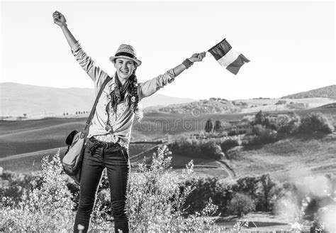 Smiling Young Woman Hiker On Tuscany Hike With Italian Flag Stock Image