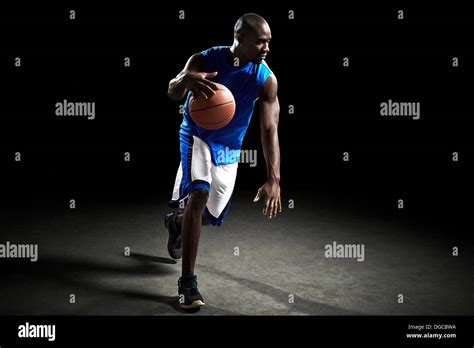 Male Basketball Player Running With Ball Stock Photo Alamy