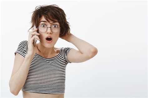 Free Photo Close Up Of Shocked Gasping Woman Learn Secret While Talking On Phone Looking Ambushed