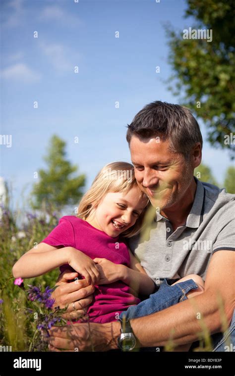 Father Hugging Daughter Stock Photo Alamy