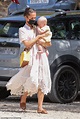Alicia Vikander cradles a baby during holiday with husband Michael ...