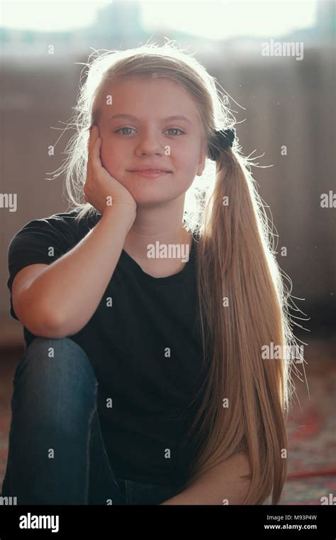 Portrait Of Beautiful Girl Teenager With Blonde Long Hair Stock Photo