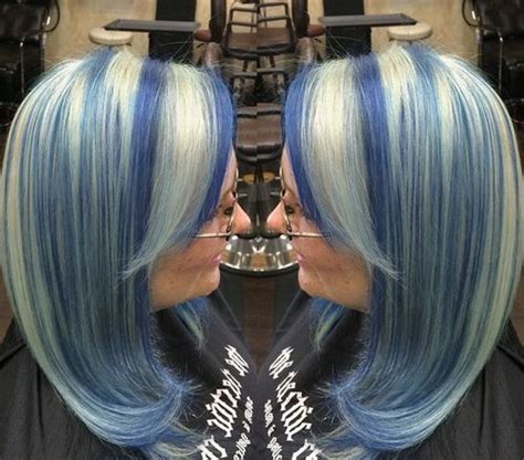 The hair is highlighted dark at the roots and lighter towards the ends. 20 Pastel Blue Hair Color Ideas You Have to Try