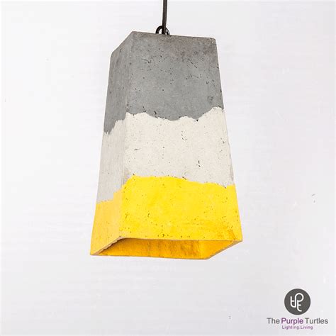 A Cement Light Hanging From A Black Wire With Yellow And White Stripes