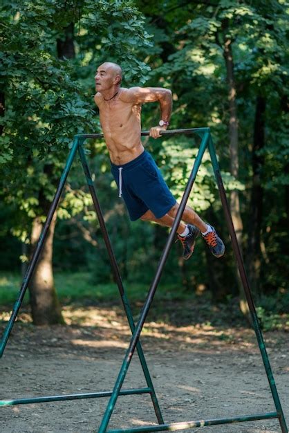 premium photo senior male exercising outdoors in public park