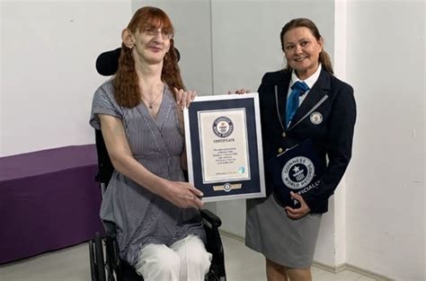 Photos At 215m Worlds Tallest Woman Breaks Records For Longest