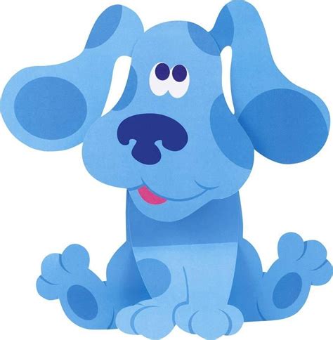 A Blue Dog Sitting On The Ground With Its Eyes Wide Open And Tongue