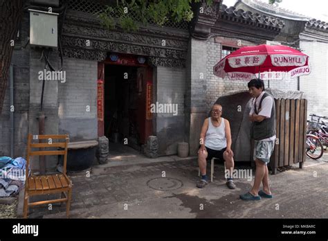 Daily Life In A Hutong Traditional Old Narrow Street Of Beijing