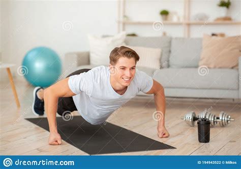Quarantine Sport Muscular Guy Doing Push Up Exercises On Fists Stock