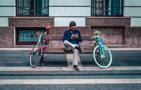 Man Sitting Between Two Bikes Image Free Stock Photo Public Domain