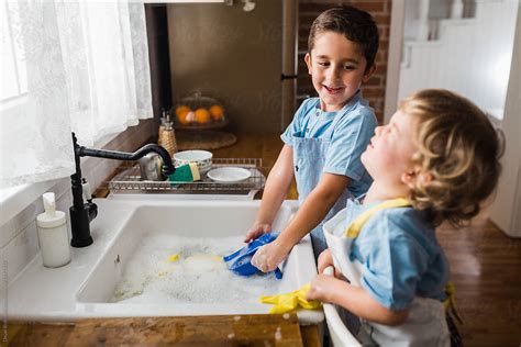 Boys Washing Dishes Doing Some Chores By Dejan Ristovski
