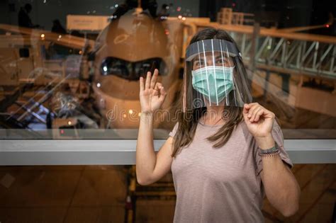 Female Passenger Ready To Board Woman Wearing Face Mask And Plastic