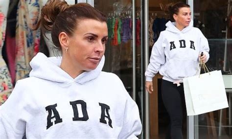 Coleen Rooney Cuts A Casual Figure In A Hoodie And Skin Tight Leggings While Bikini Shopping At